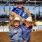 MI110264-Tourism and Events Queensland Open Saddle Bronc Champion Tony Caldwell with his children Austin (5yo) and Georgia (6yo)