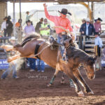 MI225534-Blackall cowboy Jed Coote marks 57pts in the 4th section of the 2nd Divi Saddle Bronc contest